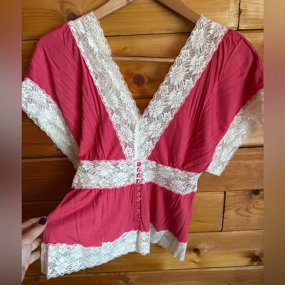 Coral v-neck cotton top with ivory lace accents!